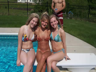 three girls posing in the pool